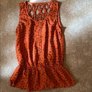 An abstract orange and green blouse